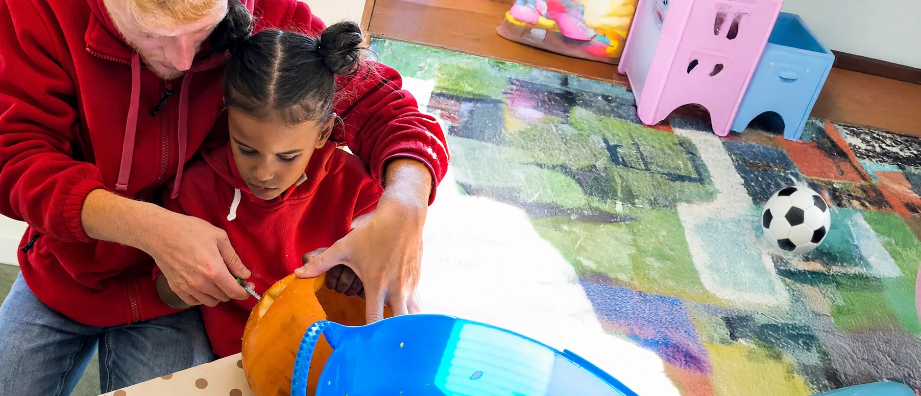 A SoLO Service User carving a pumpkin