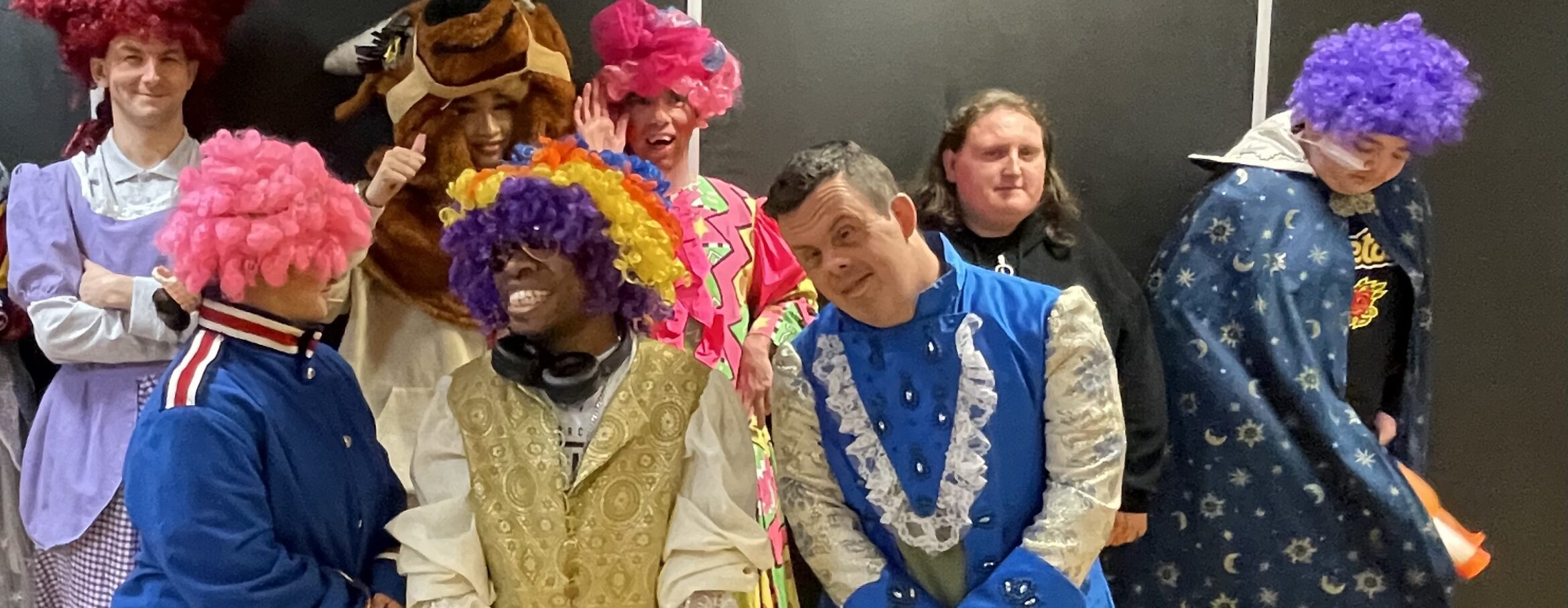 A group of members are dressed up in pantomime costumes