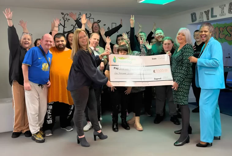 National Gas Metering donating a cheque to Social Life Opportunities