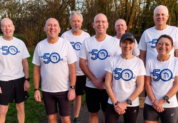 Fundraisers smiling at the camera